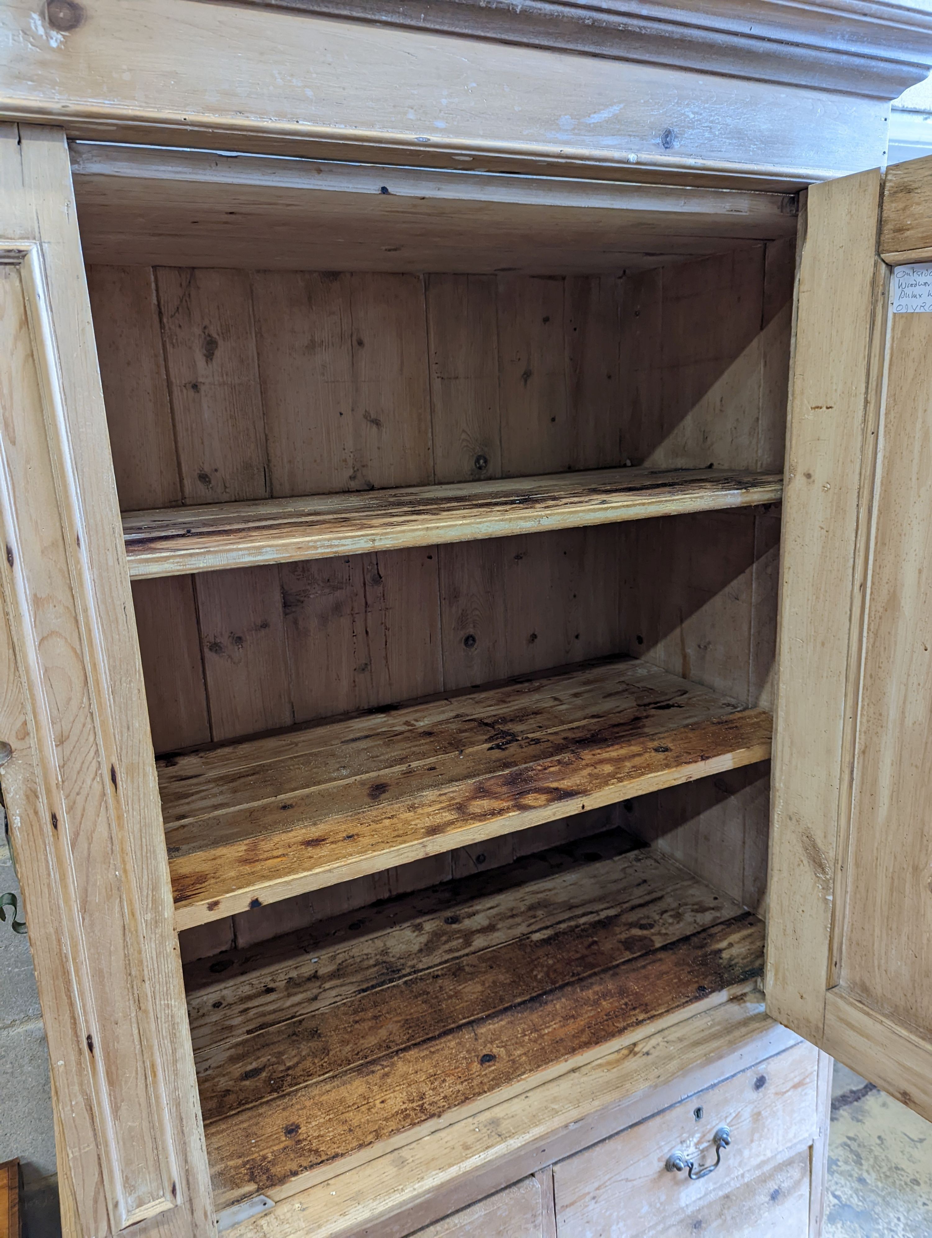 An Edwardian pine kitchen cupboard with five drawer base, width 94cm, height 193cm